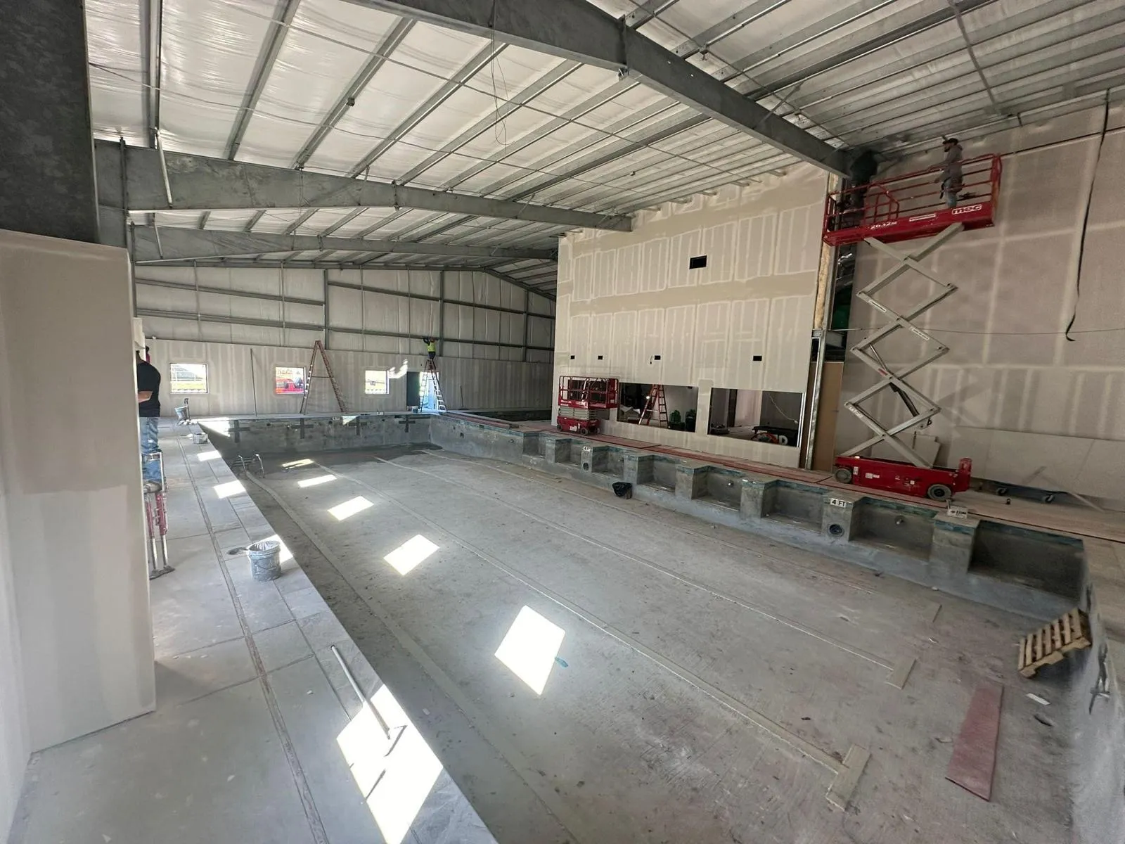 Steel-framed commercial natatorium during electrical build-out