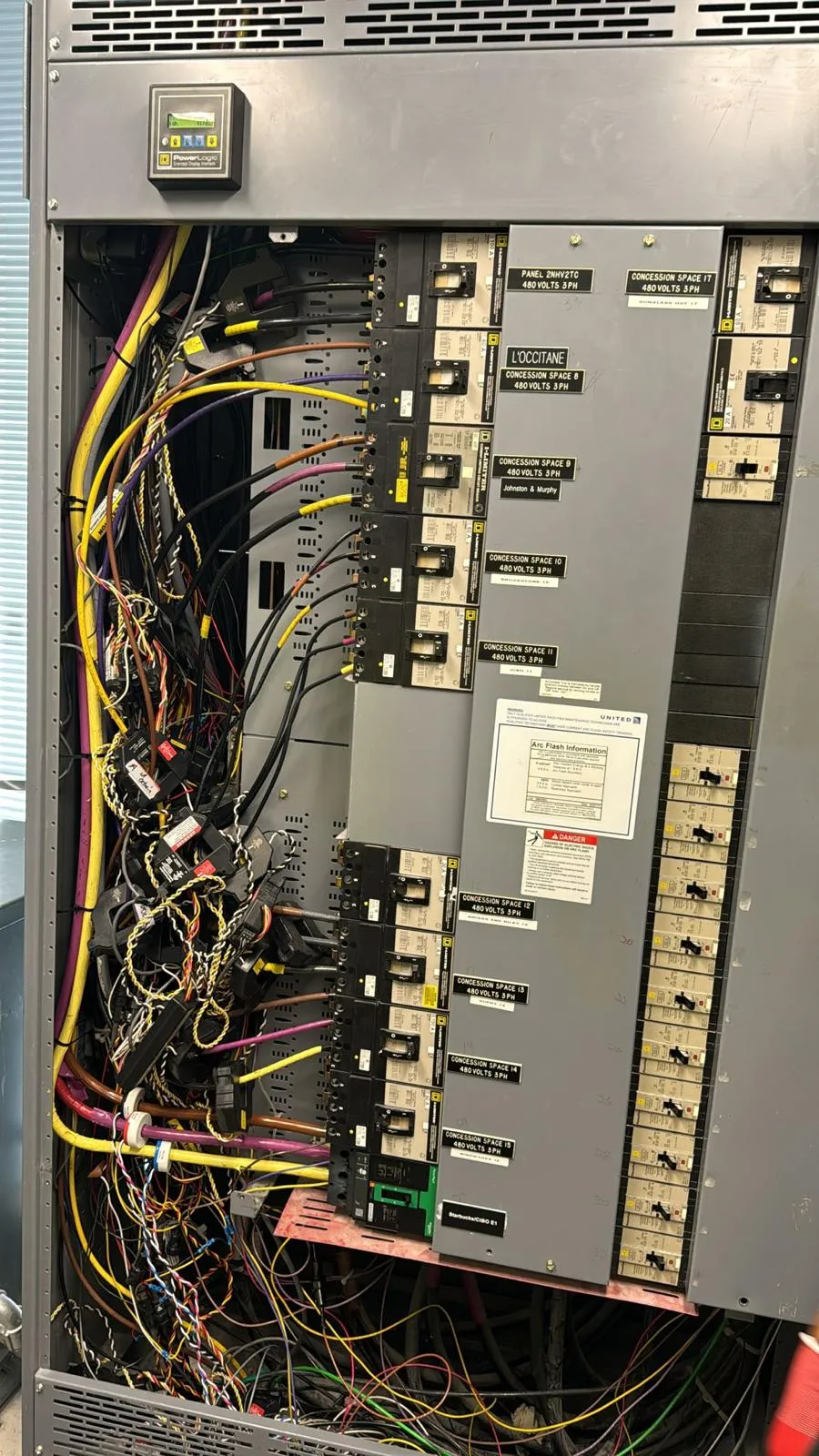 Open 480V three-phase distribution panel with metering and control wiring