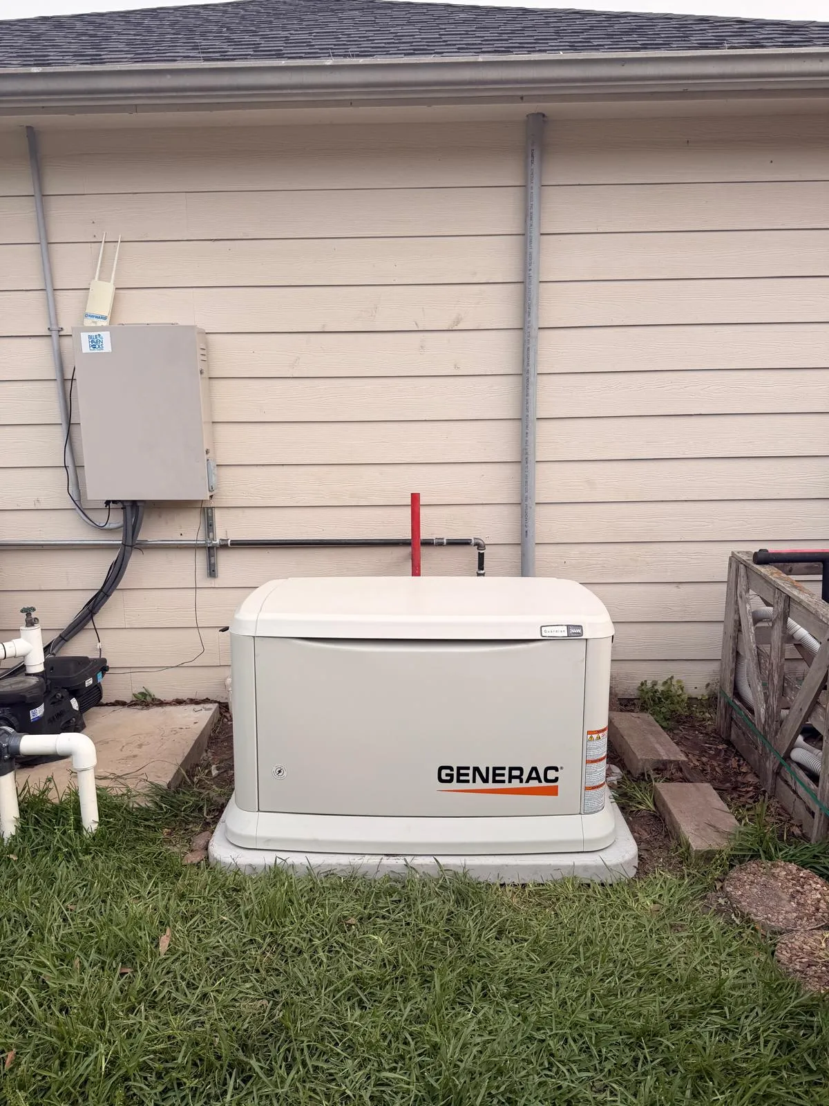 Generac home standby generator installed on a concrete pad