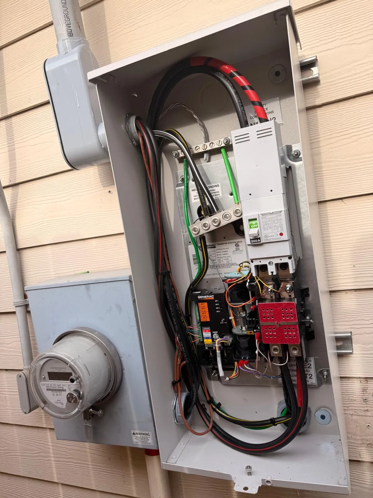 Open Generac automatic transfer switch with clean professional wiring